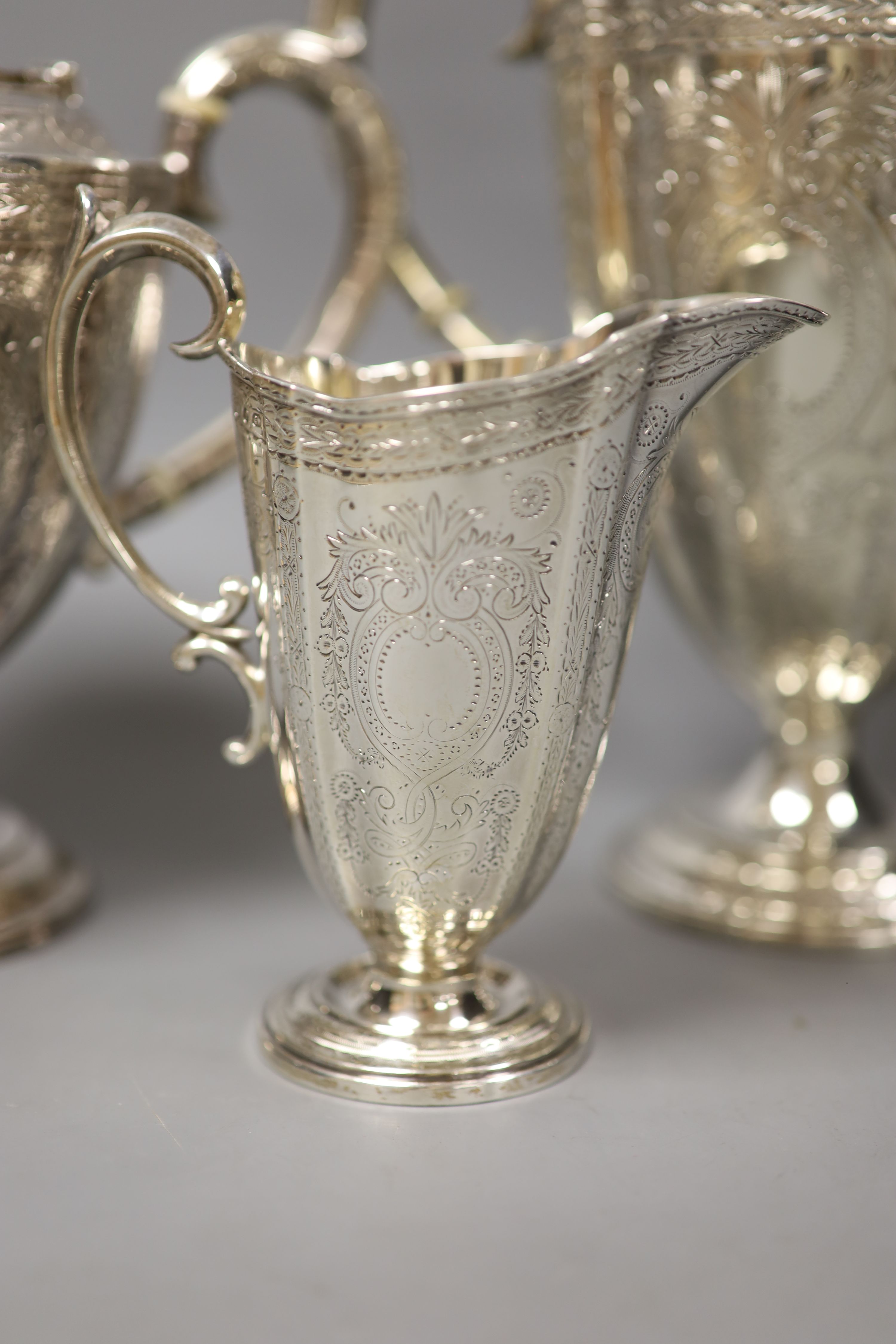 A Victorian engraved silver three-piece tea and coffee service, Frederick Elkington, Birmingham, 1872, tallest piece 27.5cm